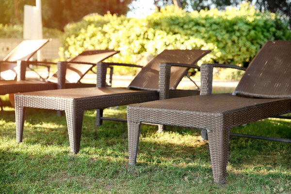 Sunbeds in courtyard of luxury hotel