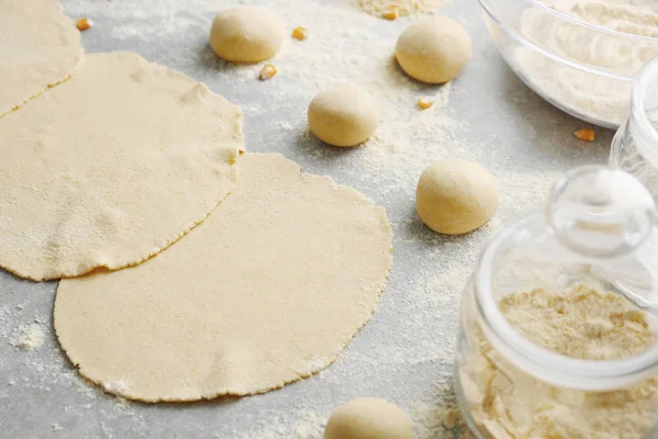 Rolled dough for tortillas on kitchen table — Stock Photo, Image