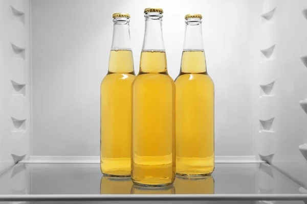 Bottles of lemonade in fridge — Stock Photo, Image