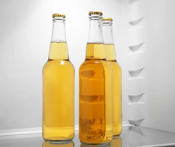 Bottles of lemonade in fridge — Stock Photo, Image