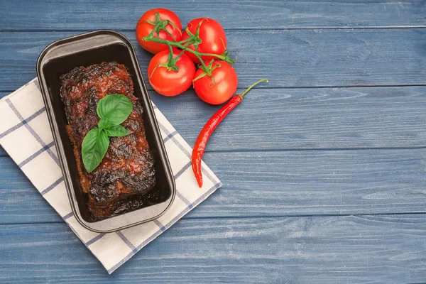 Baking dish with tasty turkey meatloaf on wooden table — Stock Photo, Image