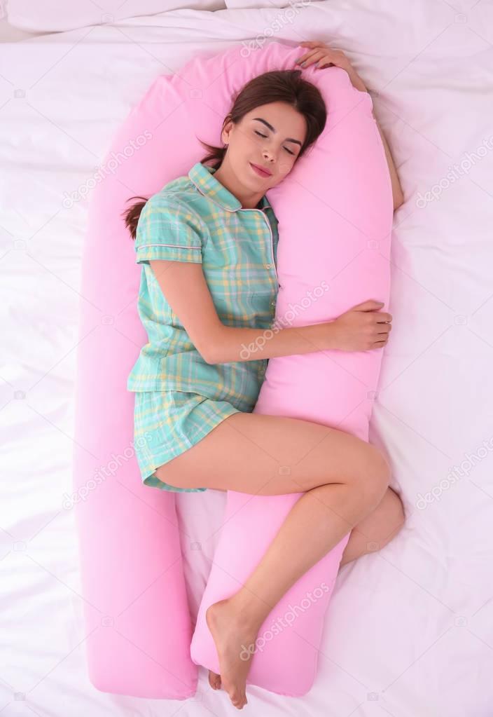 Young woman sleeping in bed 