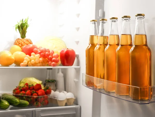 Bottles of lemonade in fridge — Stock Photo, Image