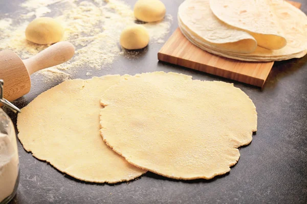 Rolled dough for tortillas on kitchen table — Stock Photo, Image