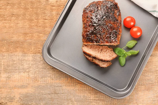Tasty turkey meatloaf with basil and tomatoes on baking tray — Stock Photo, Image