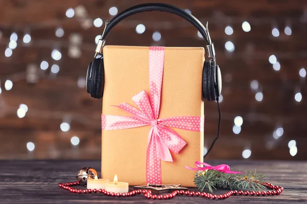 Composition with gift box and headphones
