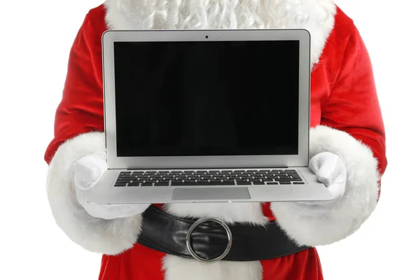 Santa Claus sosteniendo portátil sobre fondo blanco — Foto de Stock