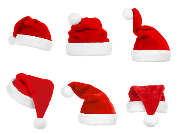 Collage von Weihnachtsmannhüten auf weißem Hintergrund — Stockfoto