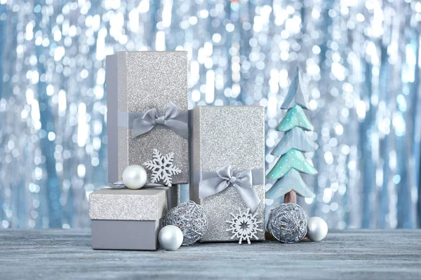 Christmas gifts and blurred lights — Stock Photo, Image