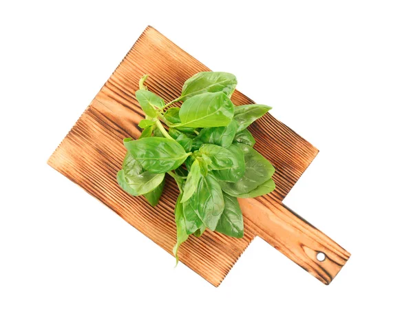 Wooden board with basil isolated on white — Stock Photo, Image