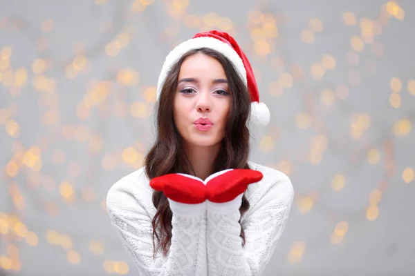 Beautiful woman in Christmas hat — Stock Photo, Image