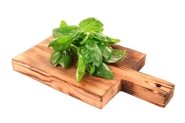 Wooden board with basil isolated on white — Stock Photo, Image