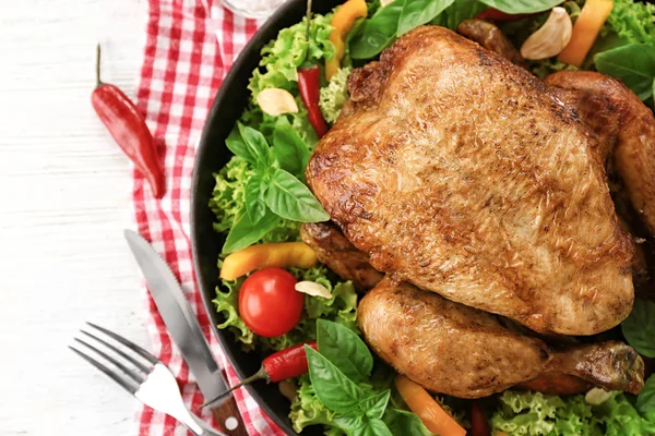 Tasty whole roasted turkey with vegetables on table — Stock Photo, Image