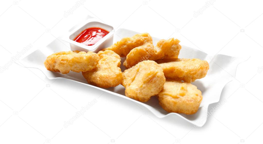 Tasty nuggets and sauce for chicken on white background
