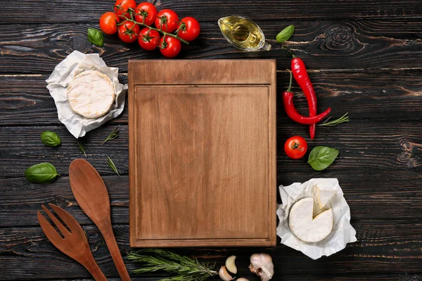 Composition with wooden board, soft cheese and vegetables on table — Stock Photo, Image