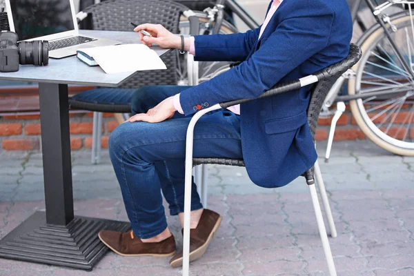 Young blogger with laptop — Stock Photo, Image