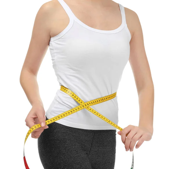 Young woman with measuring tape on white background. Diet concept — Stock Photo, Image