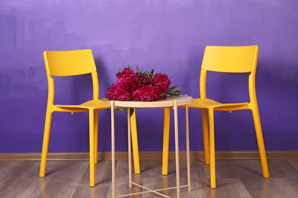 Chairs and table with peony flowers — Stock Photo, Image