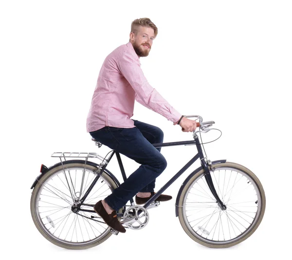 Joven hombre guapo con bicicleta sobre fondo blanco —  Fotos de Stock