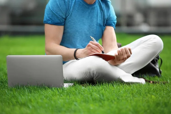 Young blogger with laptop — Stock Photo, Image