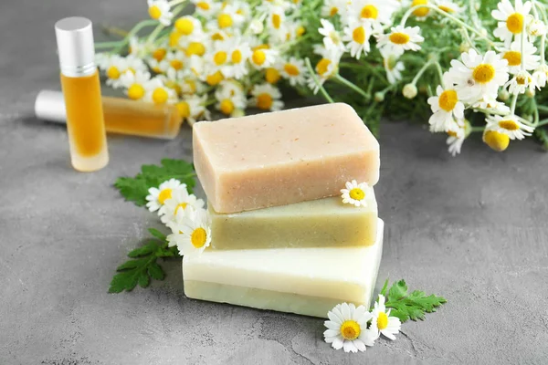 Soaps and chamomile flowers — Stock Photo, Image