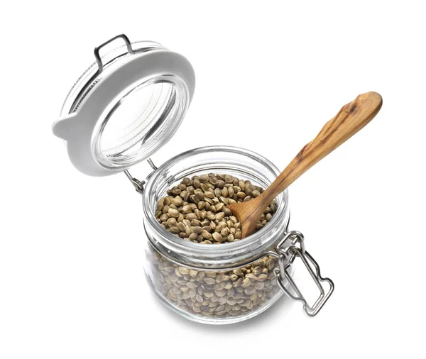 Jar with hemp seeds and spoon — Stock Photo, Image