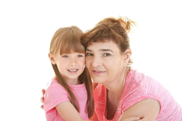 Linda niña con su abuela sobre fondo blanco — Foto de Stock