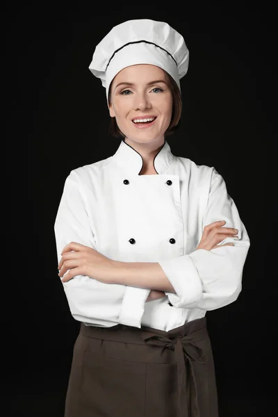 Female chef on dark — Stock Photo, Image