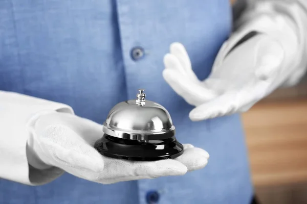 Man holding bell — Stock Photo, Image