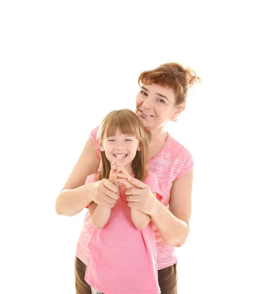 Cute little girl with her grandmother on white background — Stock Photo, Image