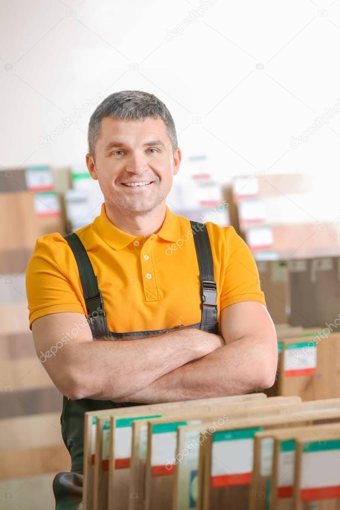 Mature carpenter in hardware store