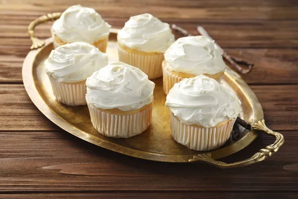 Tasty vanilla cupcakes on metal tray — Stock Photo, Image