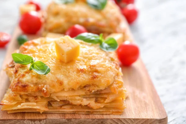 Lasagna on wooden board — Stock Photo, Image