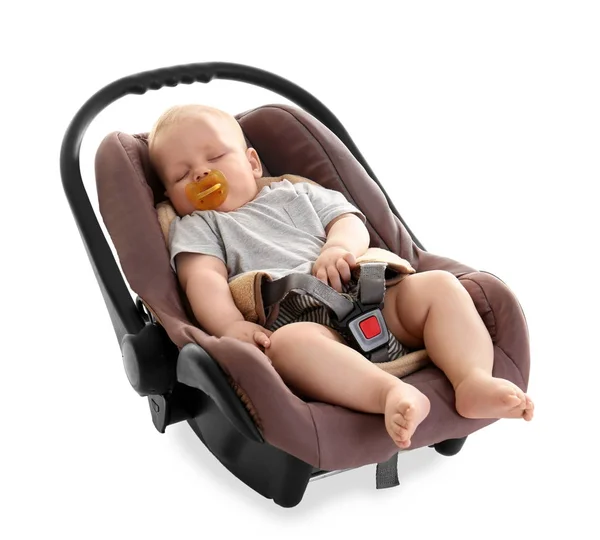 Adorable bebé con chupete durmiendo en asiento de seguridad para niños aislado en blanco — Foto de Stock