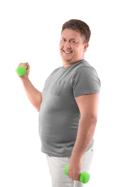 Overweight man training with dumbbells on white background — Stock Photo, Image