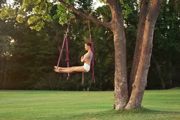 Woman practicing aerial yoga — Stock Photo, Image