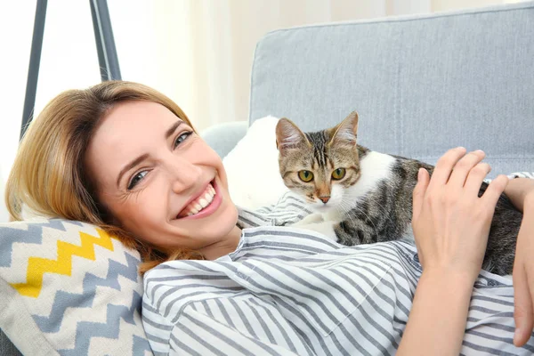 Young beautiful woman with cat at home Royalty Free Stock Photos