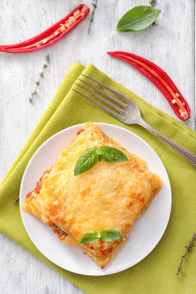 Plate with tasty lasagna on table — Stock Photo, Image