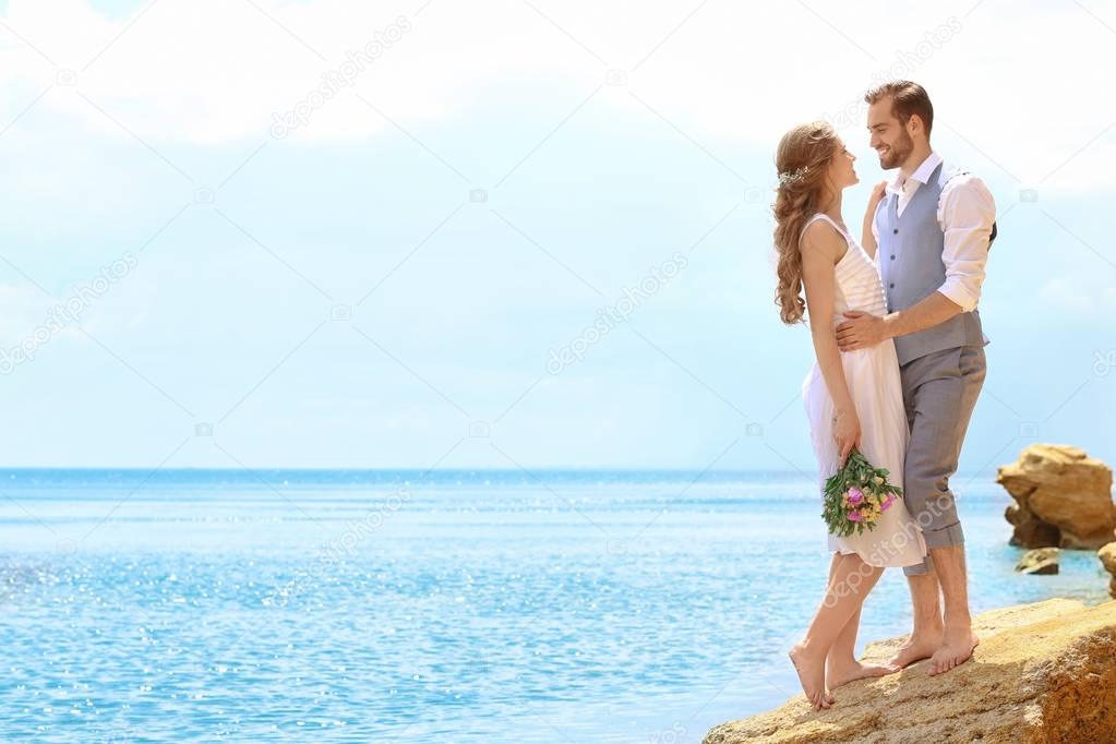 Newlywed couple on beach