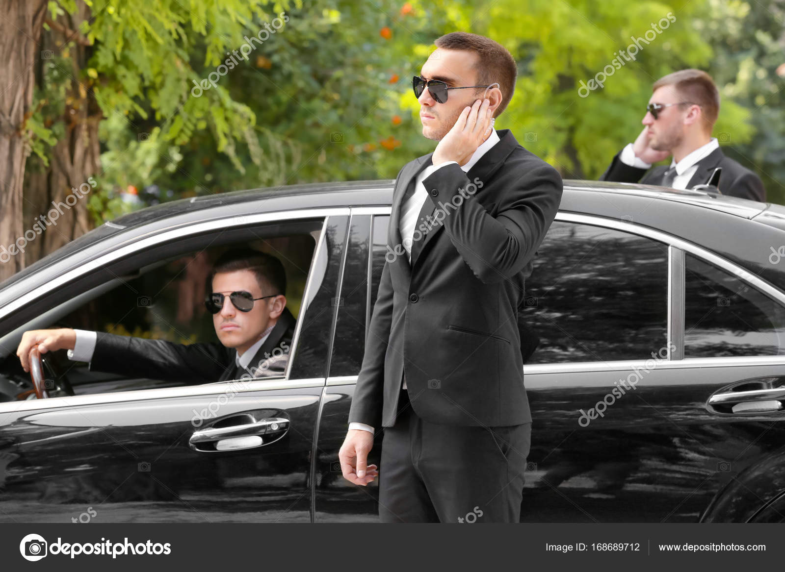 Handsome bodyguards near car Stock Photo by ©belchonock 168689712