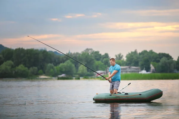 Man fishing on river