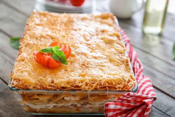 Tasty lasagna in baking dish — Stock Photo, Image