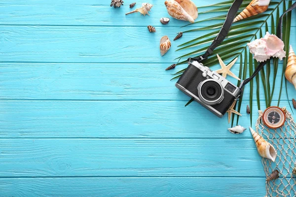 Composition with camera and compass on wooden background. Summer vacation concept — Stock Photo, Image