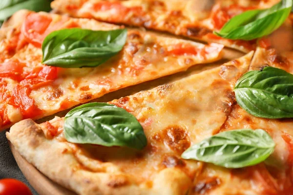 Delicious pizza with basil — Stock Photo, Image