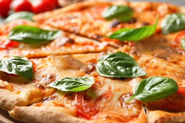 Delicious pizza with basil — Stock Photo, Image