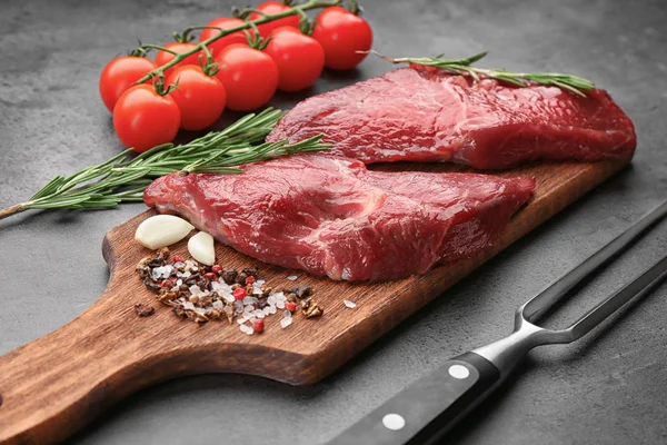 Two raw steaks with rosemary — Stock Photo, Image