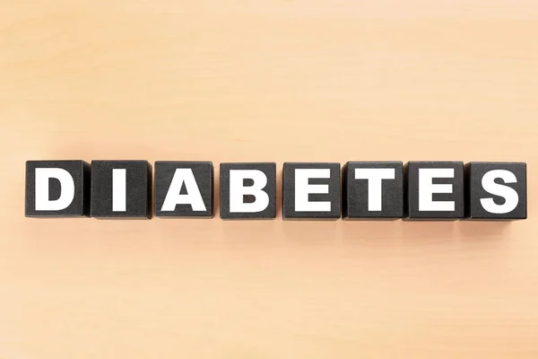 Palabra Diabetes hecha de cubos oscuros —  Fotos de Stock