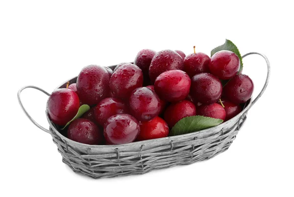 Ripe plums in basket on white background — Stock Photo, Image
