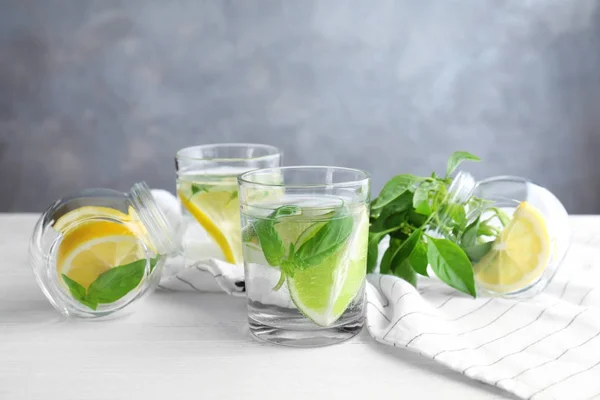 Basil water in glass ware on table — стоковое фото