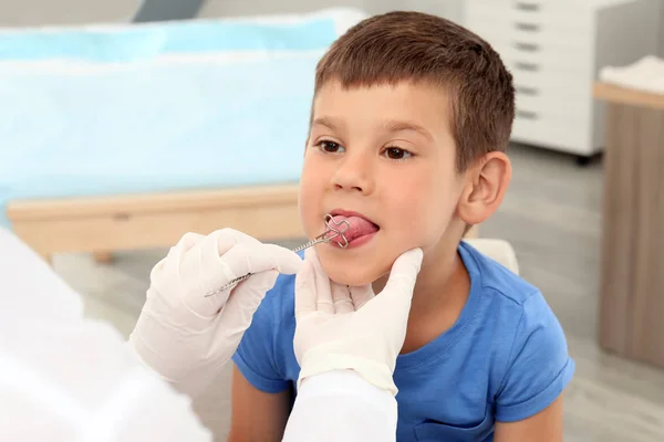 Cute boy at speech therapist's office Stock Picture
